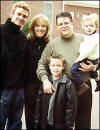 Justin with dad Randy, stepmom Lisa, and half brothers Stephen and Jonathan