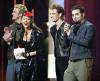 Justin, Alicia Keys, JC, & Chris present an award at the 2002 American Music Awards.  (Jan. 9, 2002)