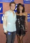 Lance & actress Jennifer Gimenez pose as they arrive for a concert to benefit the John Kerry campaign for the presidency, at the Henry Fonda Theater in Los Angeles (July 6, 2004)